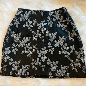 Black, gray, and white floral skirt.